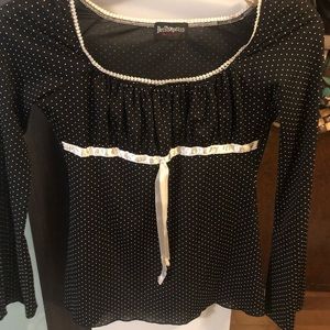 Black and white polka dot sheer blouse.
